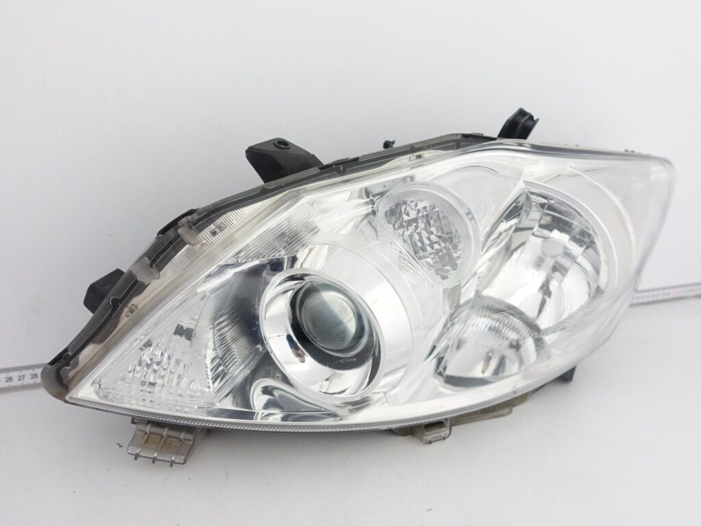 TOYOTA AURIS I HYBRID LIFT 09-12 LAMPA LEWA ZWYKŁA HALOGEN PRZÓD EUROPA