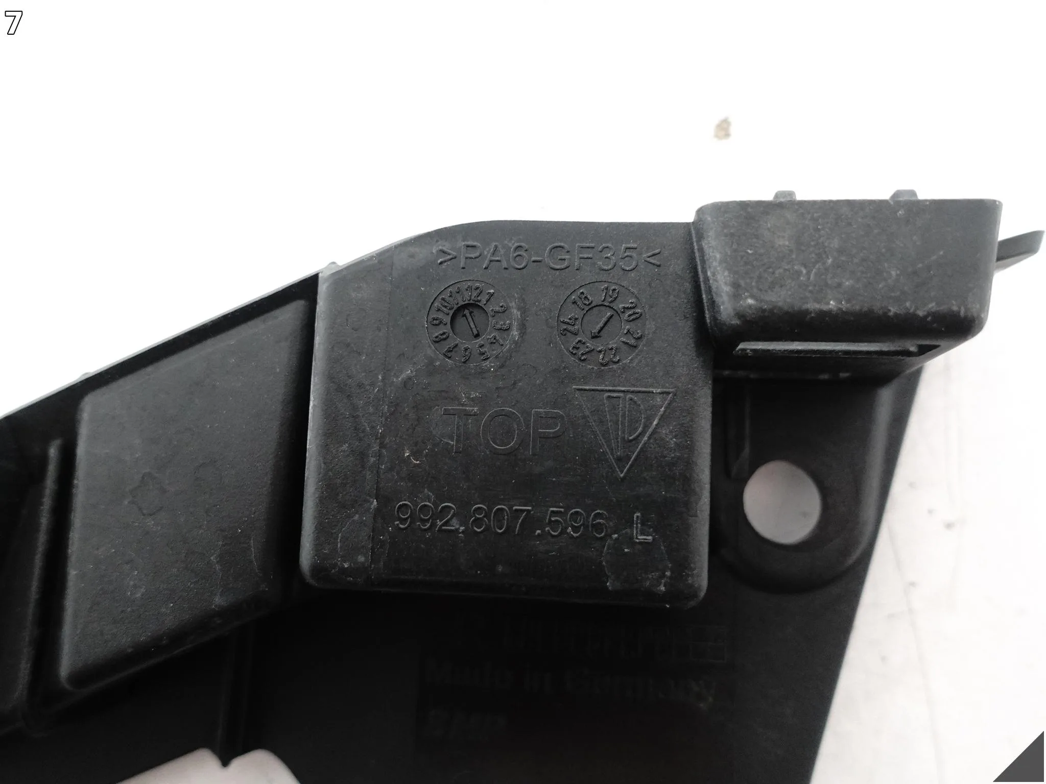 PORSCHE 911 992 19-25 ŚLIZG WSPORNIK LISTWA POD LAMPĘ ZDERZAK PRZÓD PRAWY 9c55f45ff3469df4004ec01354126169