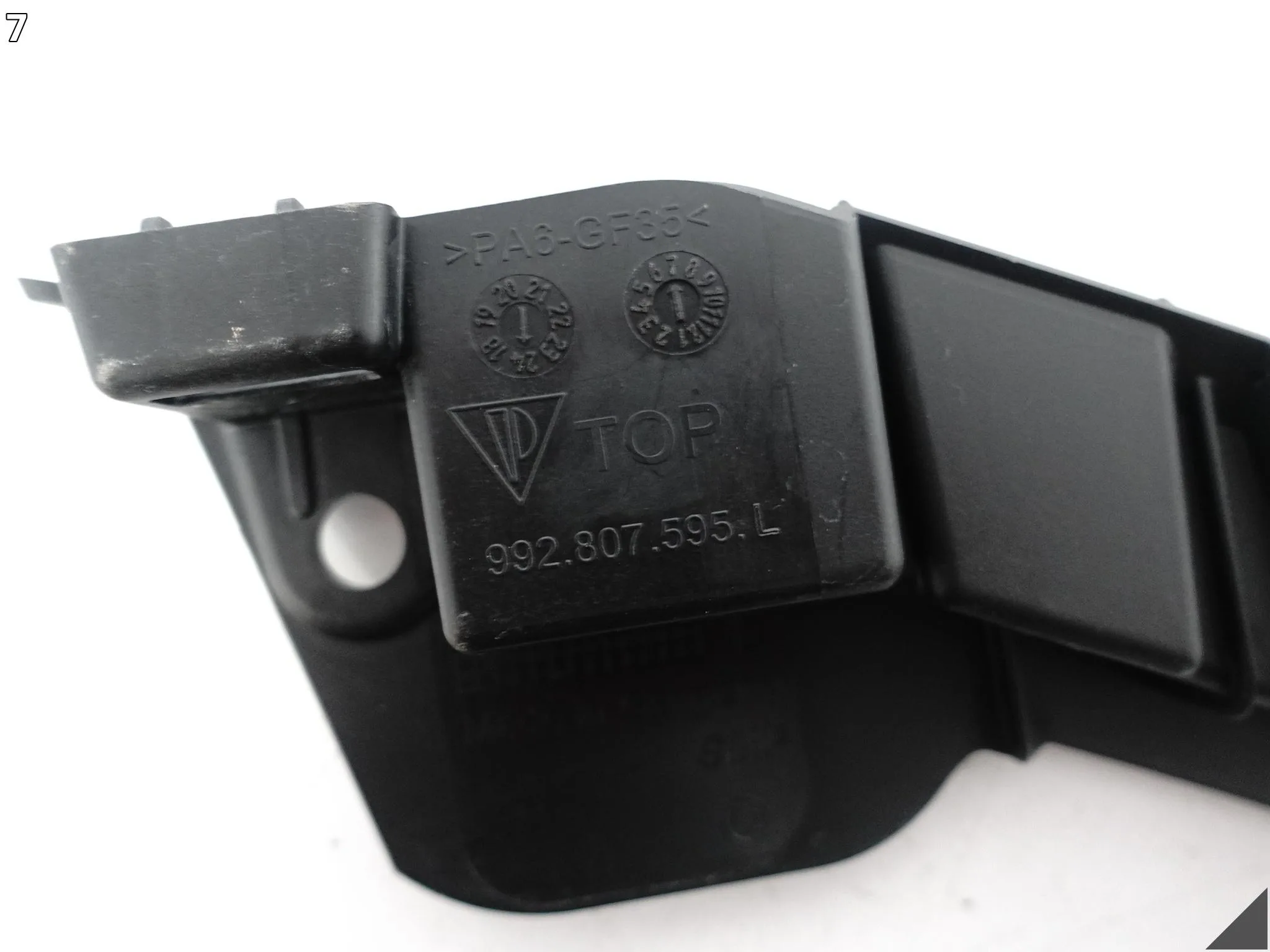 PORSCHE 911 992 19-25 ŚLIZG WSPORNIK LISTWA POD LAMPĘ ZDERZAK PRZÓD LEWY 0228d097a1c61fd2faedc4cd4a352109